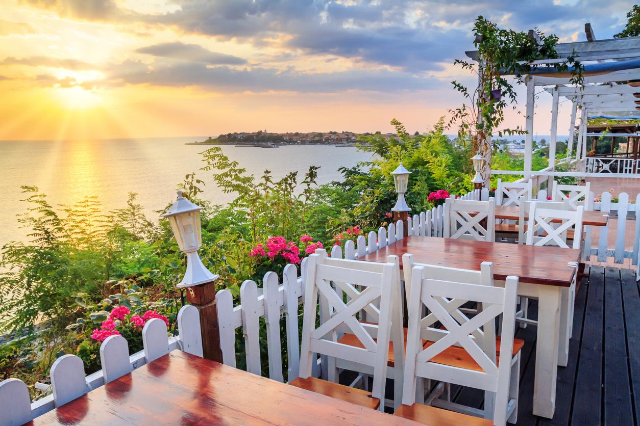 Seaside landscape - the cafe on the embankment view of the Old Town of Nesebar