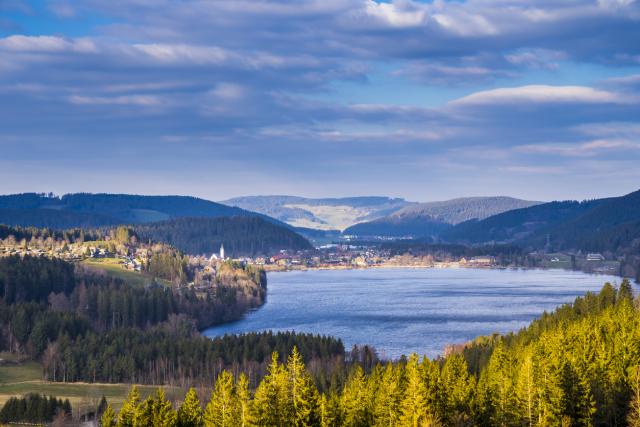 Germany, Schwarzwald aerial panorama view above famous city titisee neustadt alongside the beach of titisee lake seen above the tree tops