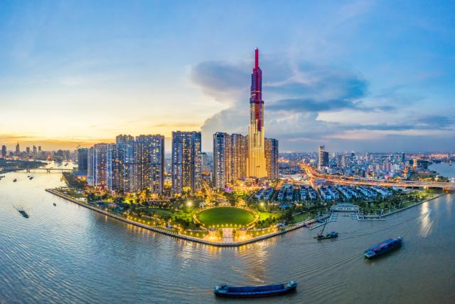 Top view aerial of center Ho Chi Minh City and Saigon bridge with development buildings, transportation, energy power infrastructure. Financial and business centers in Vietnam. View from District 2