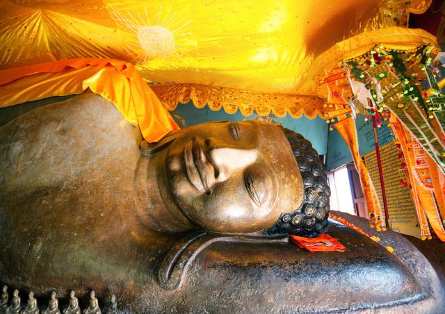Phnom Kulen Buddha in Ang Thom temple in Siem Reap